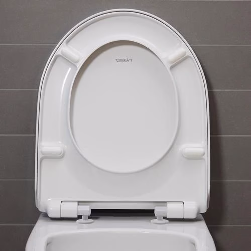 Abattant de toilette blanc Duravit n° 1 avec mécanisme de fermeture amortie et charnières en acier inoxydable.